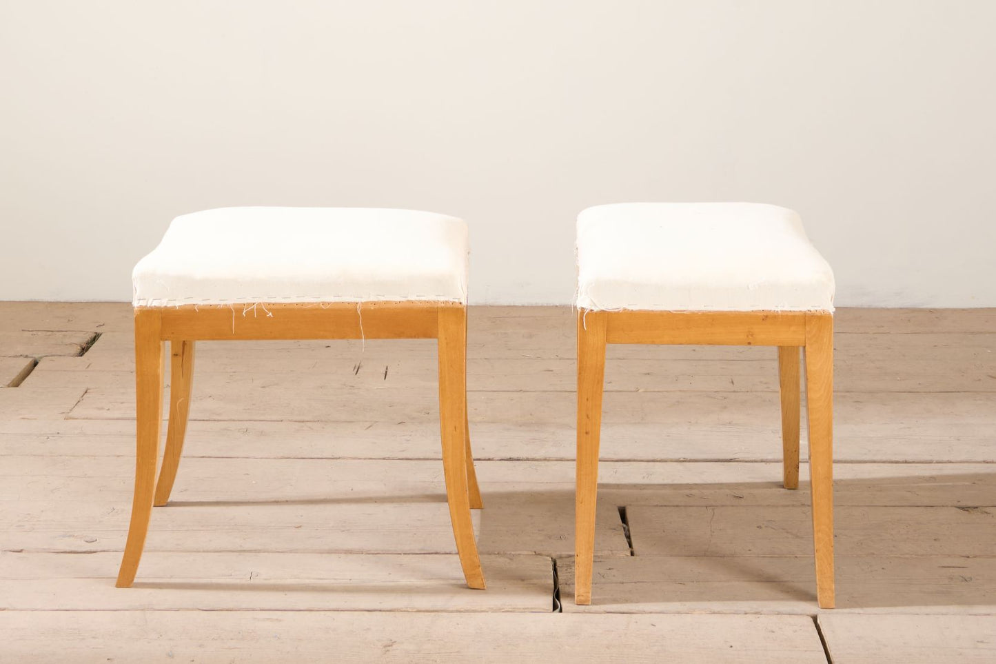 Early 20th century pair of Swedish satin birch stools