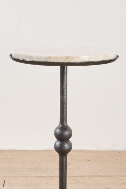 The 'Brokkr' forged steel martini table with quartzite top