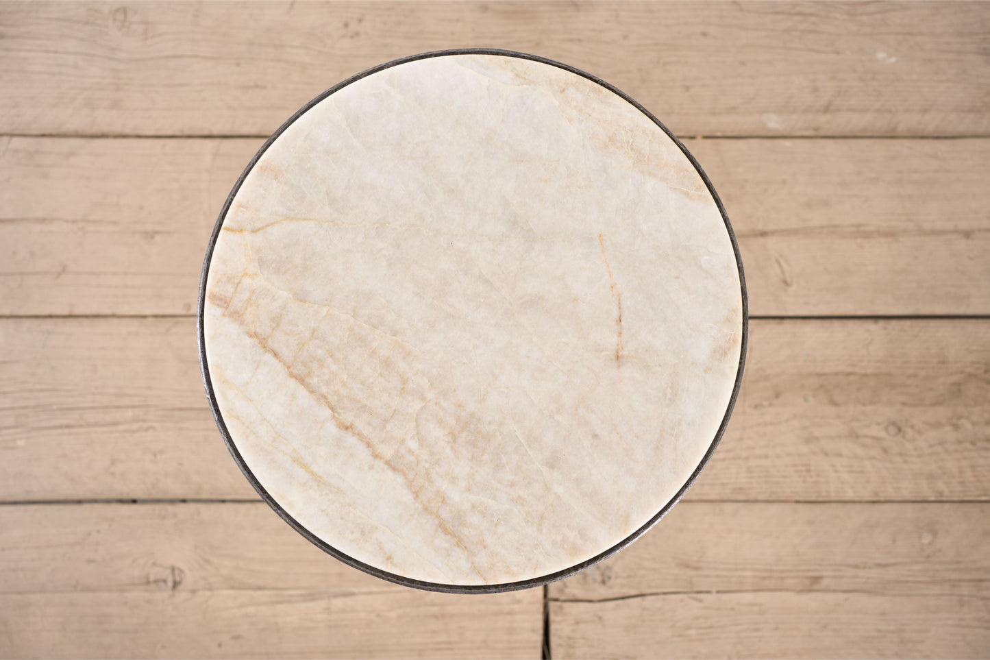 The 'Brokkr' forged steel martini table with quartzite top