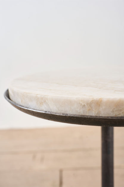 The 'Brokkr' forged steel martini table with quartzite top