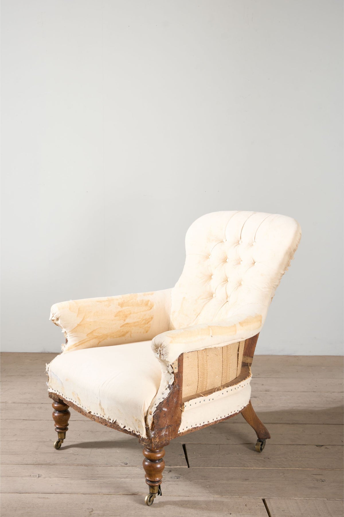 Early Victorian buttoned back country house armchair - TallBoy Interiors