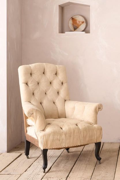Pair of Napoleon III buttoned back and seat armchairs