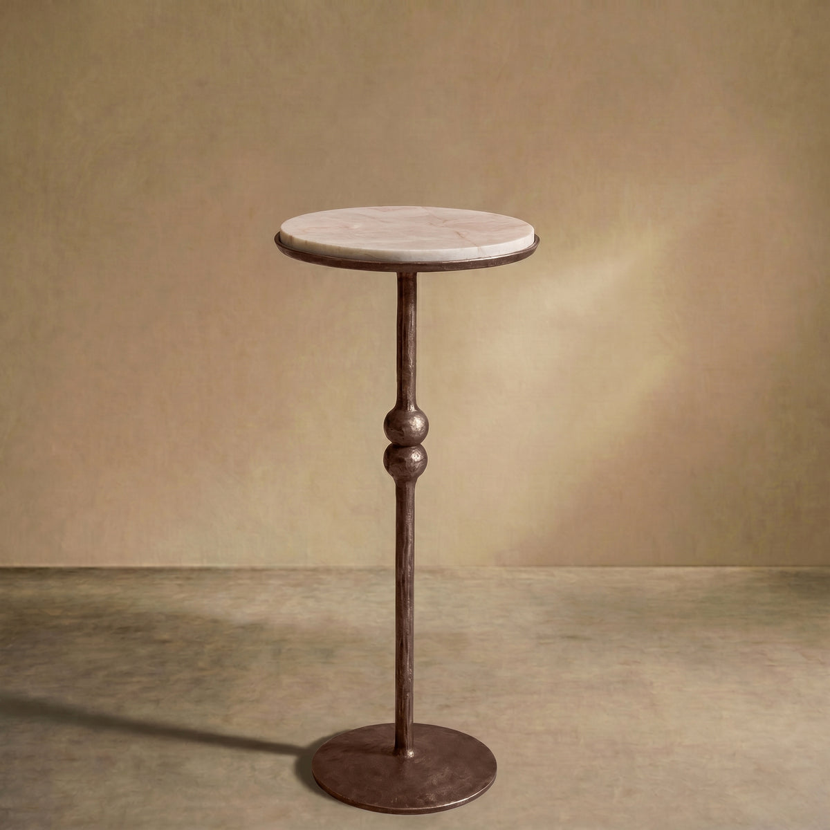The 'Brokkr' forged martini table with quartzite top