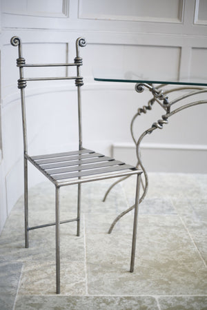 Mid 20th century burnished metal garden table and chairs - TallBoy Interiors