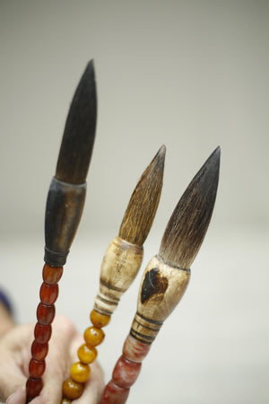 3x 20th century Japanese calligraphy brushes- Amber and stone