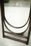 Pair of mid 20th century bamboo mirrors with luggage shelf