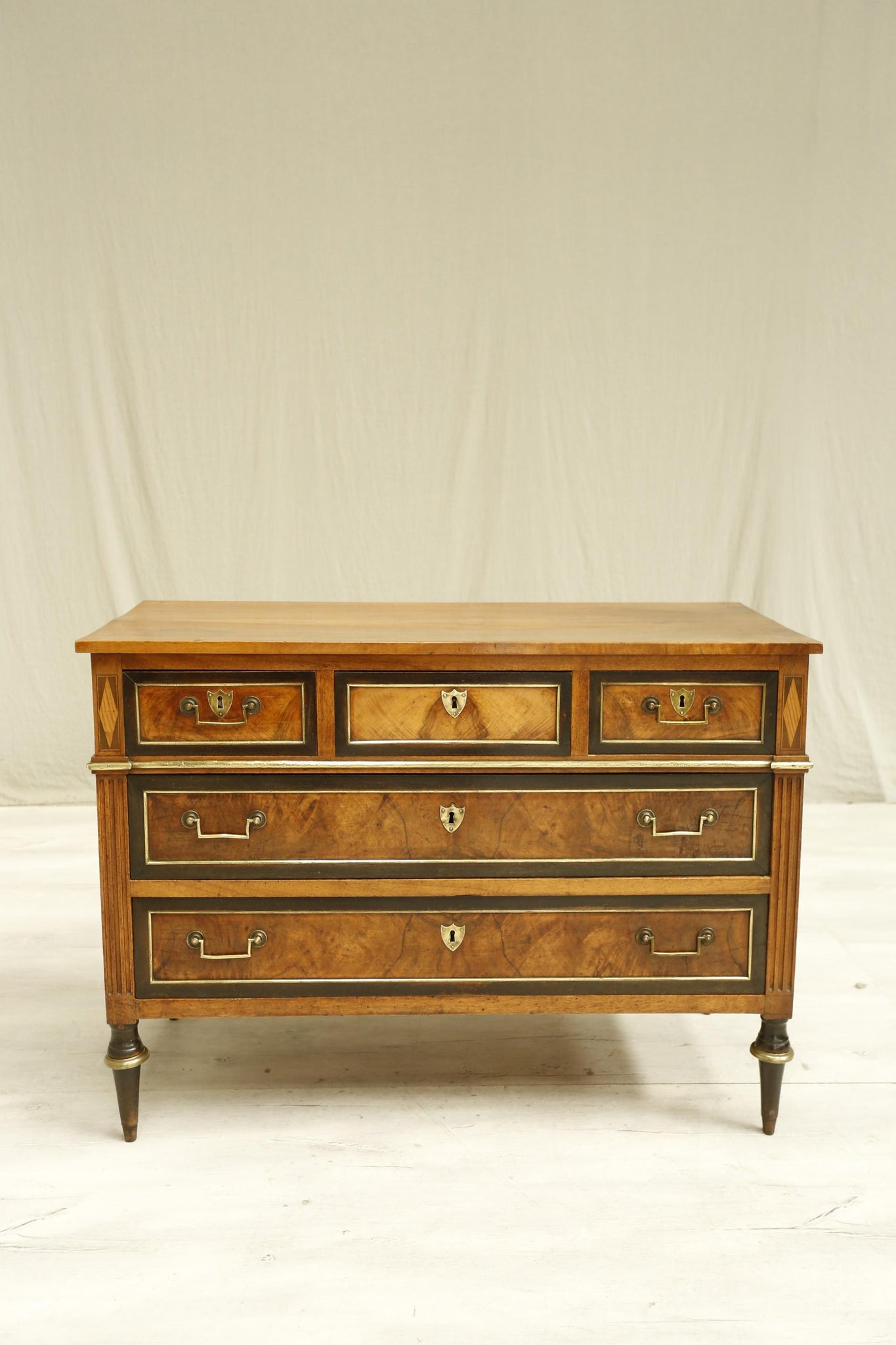 Antique 19th century French walnut and ebony chest of drawers