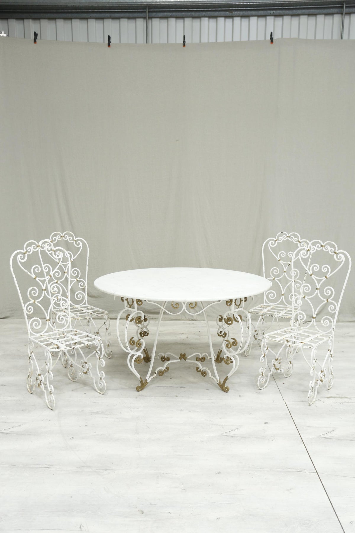 Antique white marble circular garden table and chairs - TallBoy Interiors