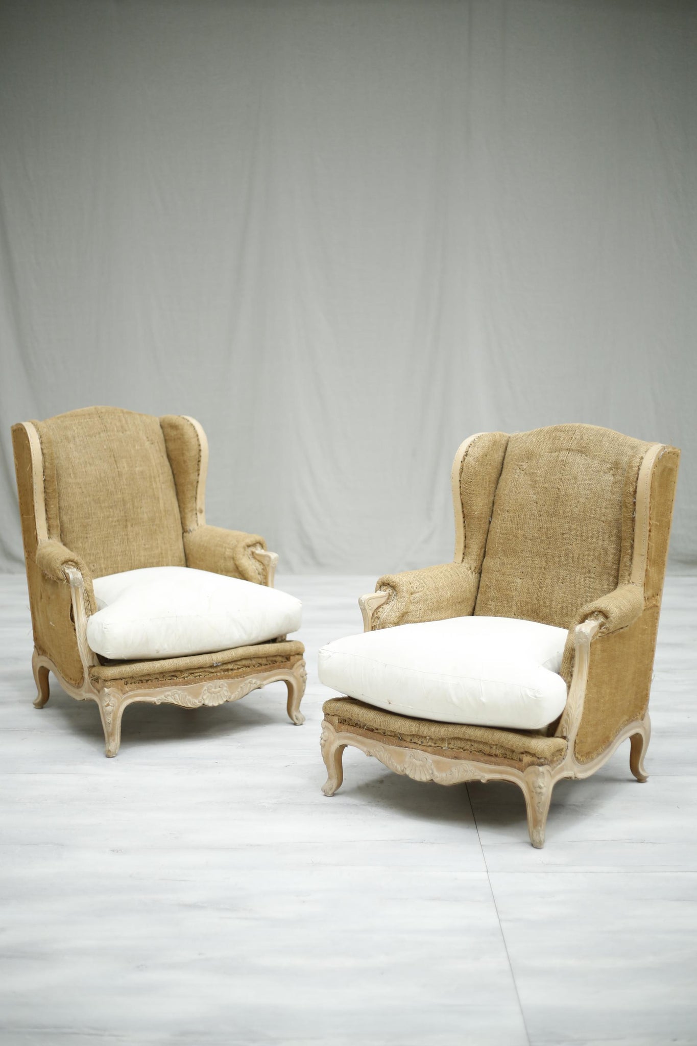 Pair of c.1920 French bleached frame wingback armchairs - TallBoy Interiors
