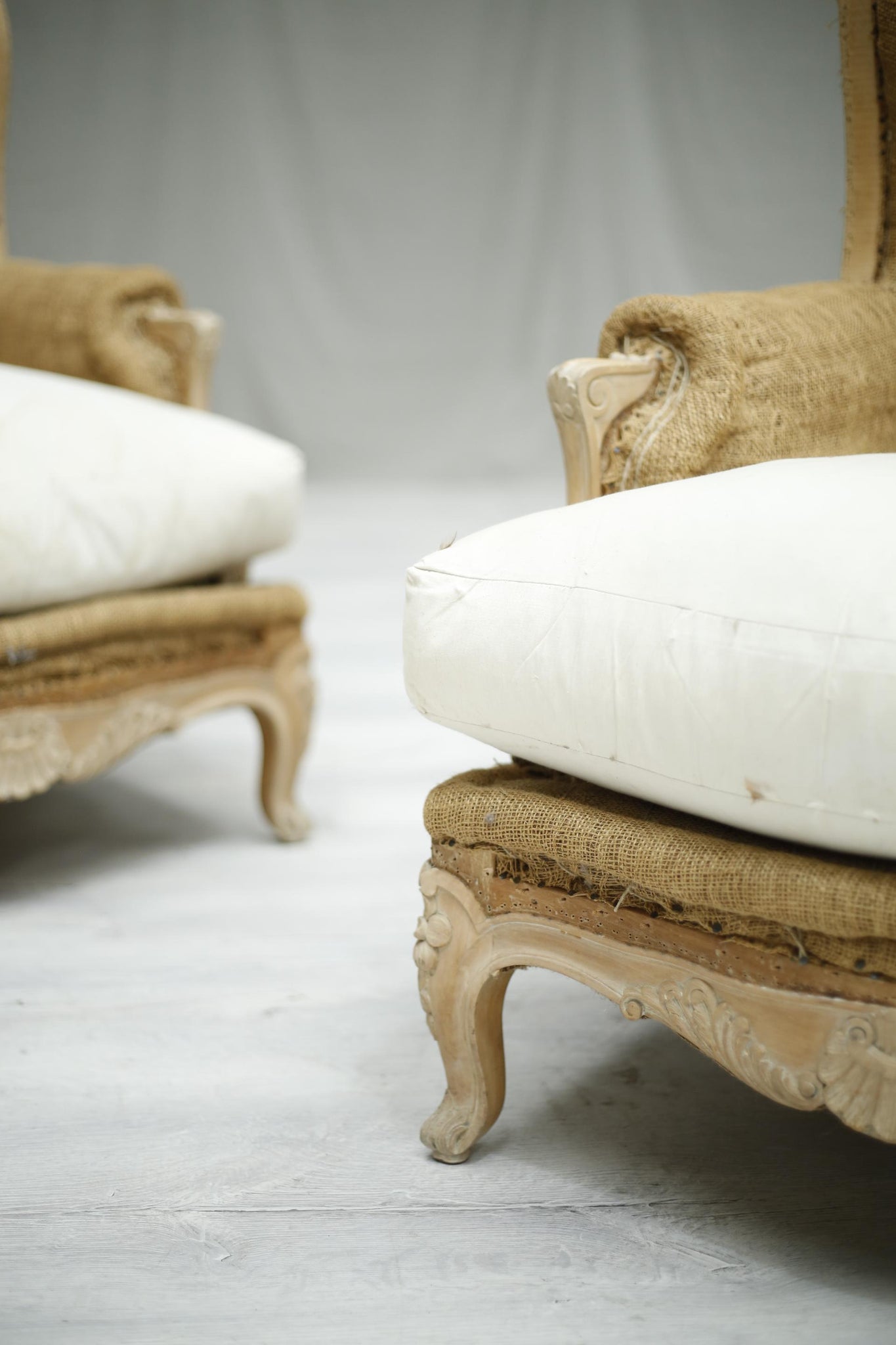 Pair of c.1920 French bleached frame wingback armchairs - TallBoy Interiors