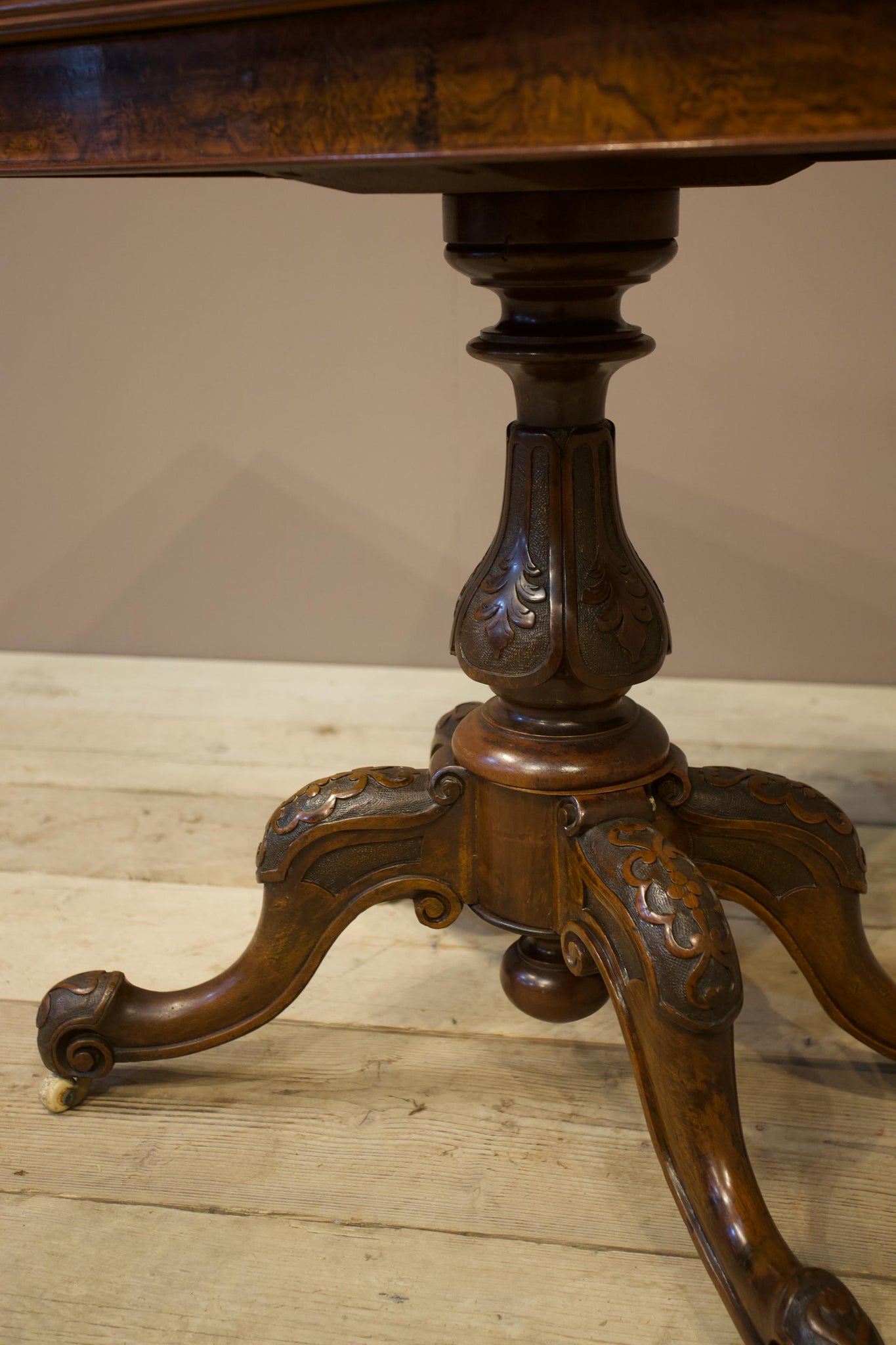 Victorian mahogany fold over table with carved base