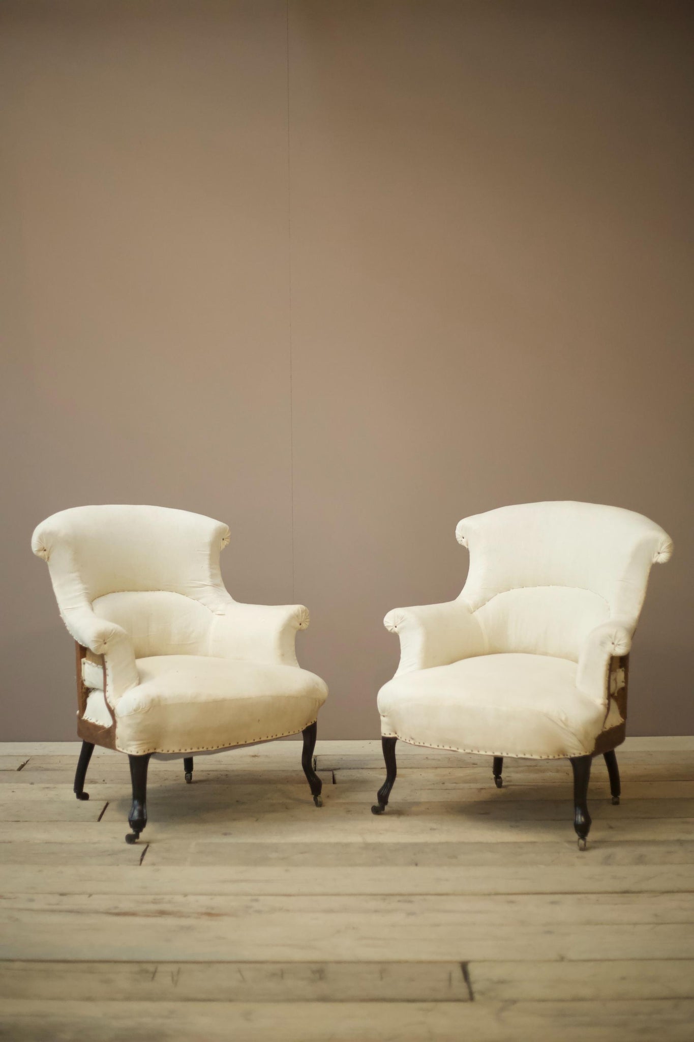 Pair of Napoleon III Plain fishtail armchairs