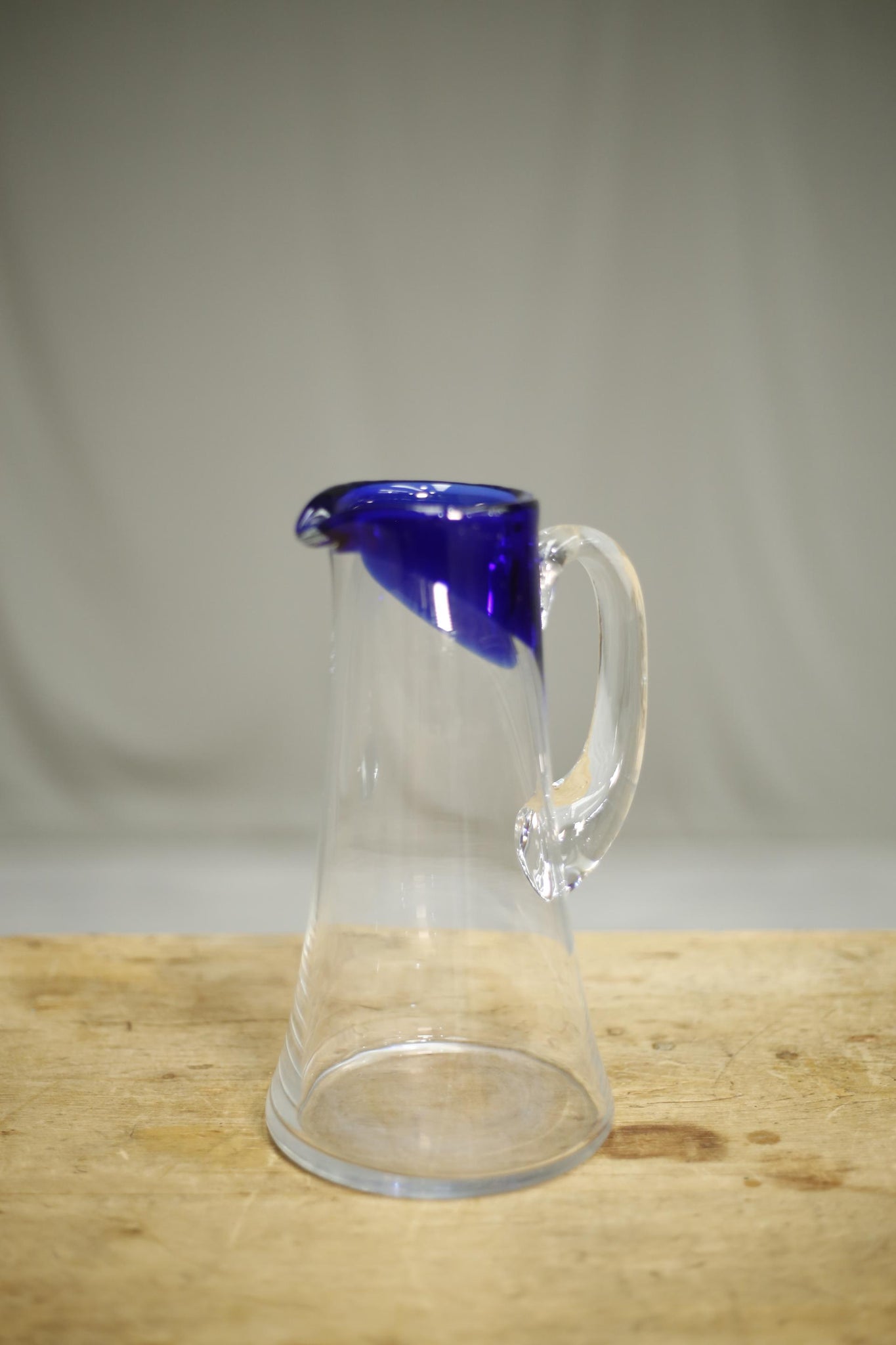 20th century clear glass jug with blue decoration