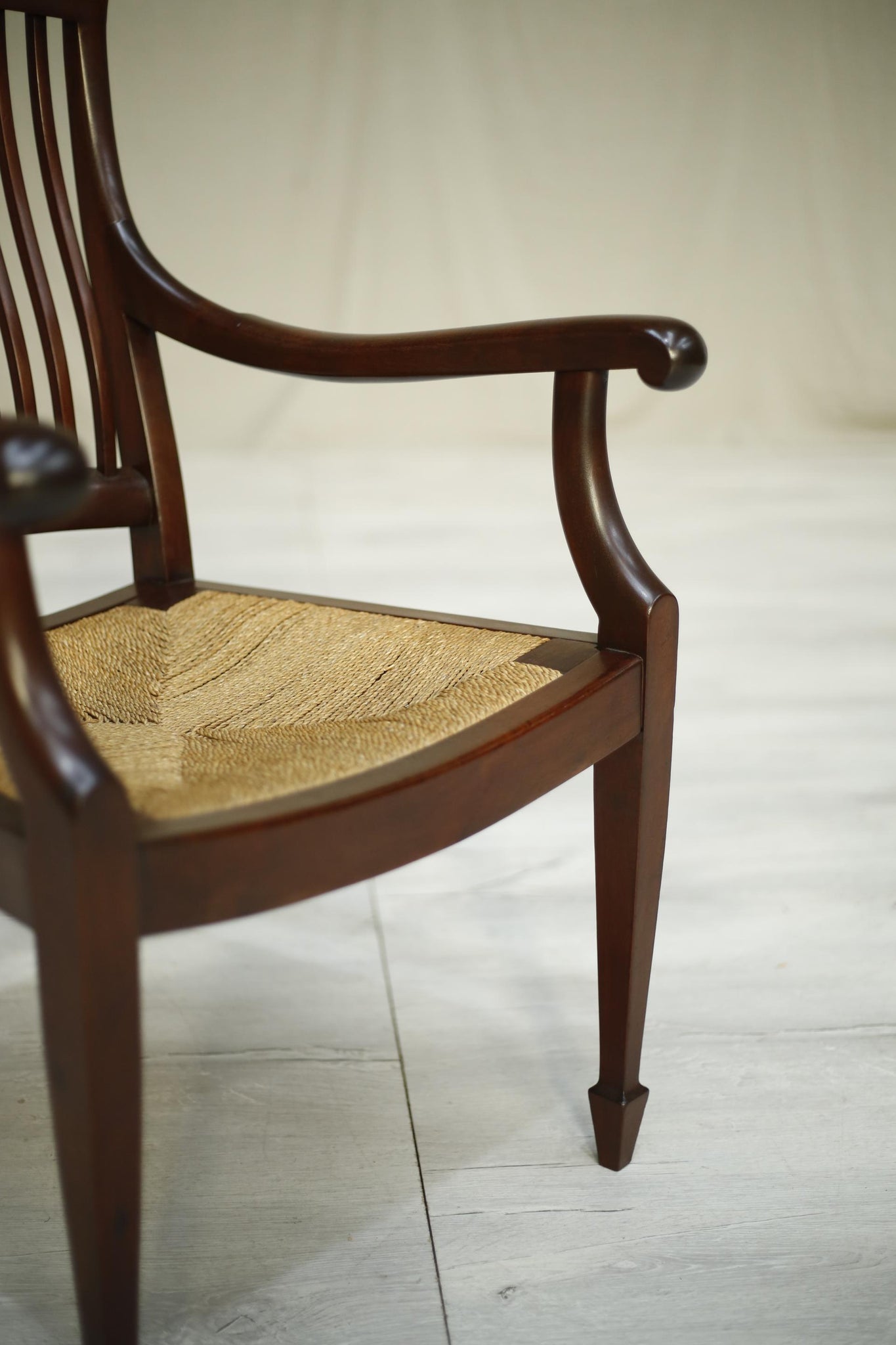 Early 20th century antique mahogany rush seated desk chair