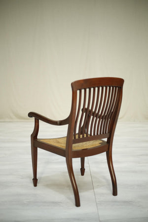 Early 20th century antique mahogany rush seated desk chair