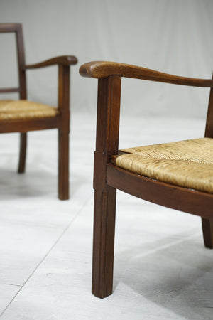 Pair of 1940's Brutalist oak and rush seated lounge chairs