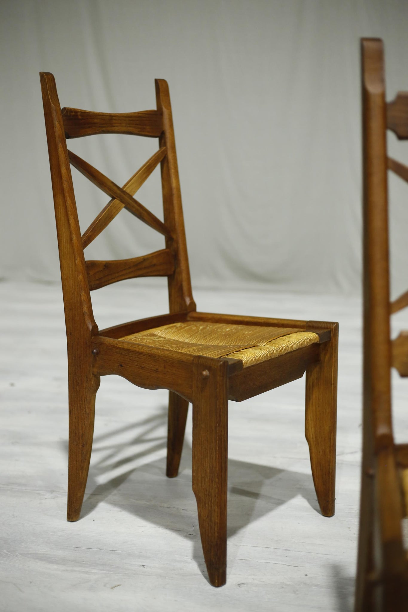 Set of 4 Guillerme et Chambron oak and rush seated dining chairs