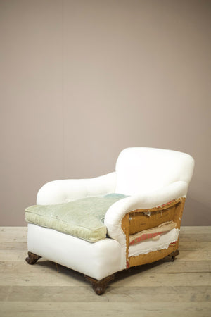 Antique English country house armchair in Howard and sons style