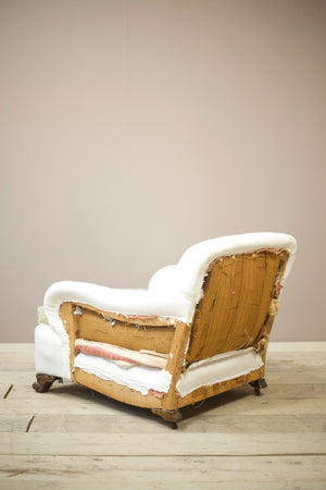 Antique English country house armchair in Howard and sons style