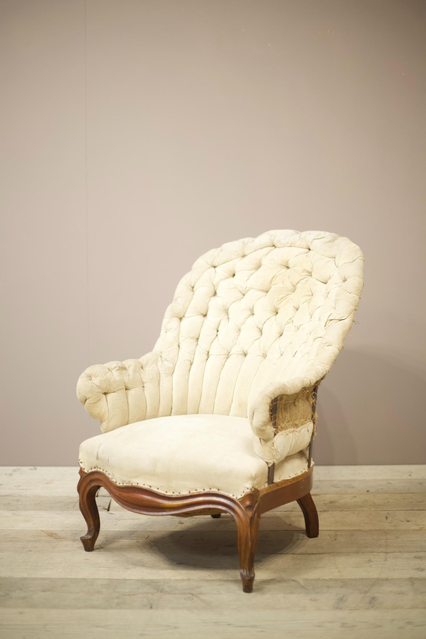 19th century French buttoned iron back armchair