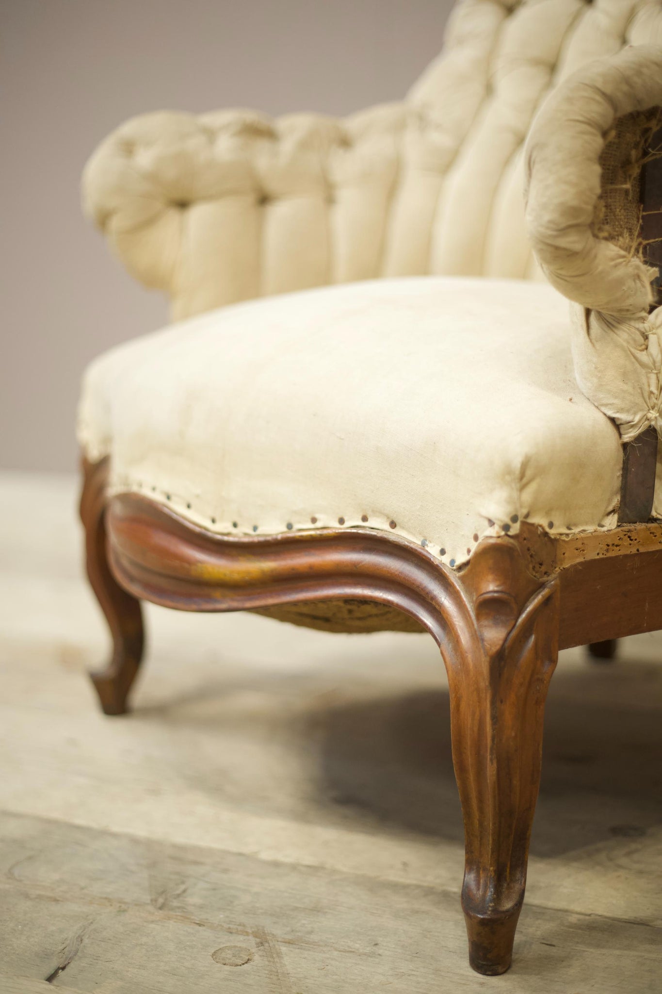 19th century French buttoned iron back armchair