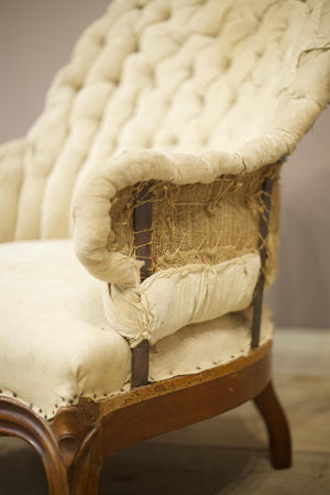 19th century French buttoned iron back armchair