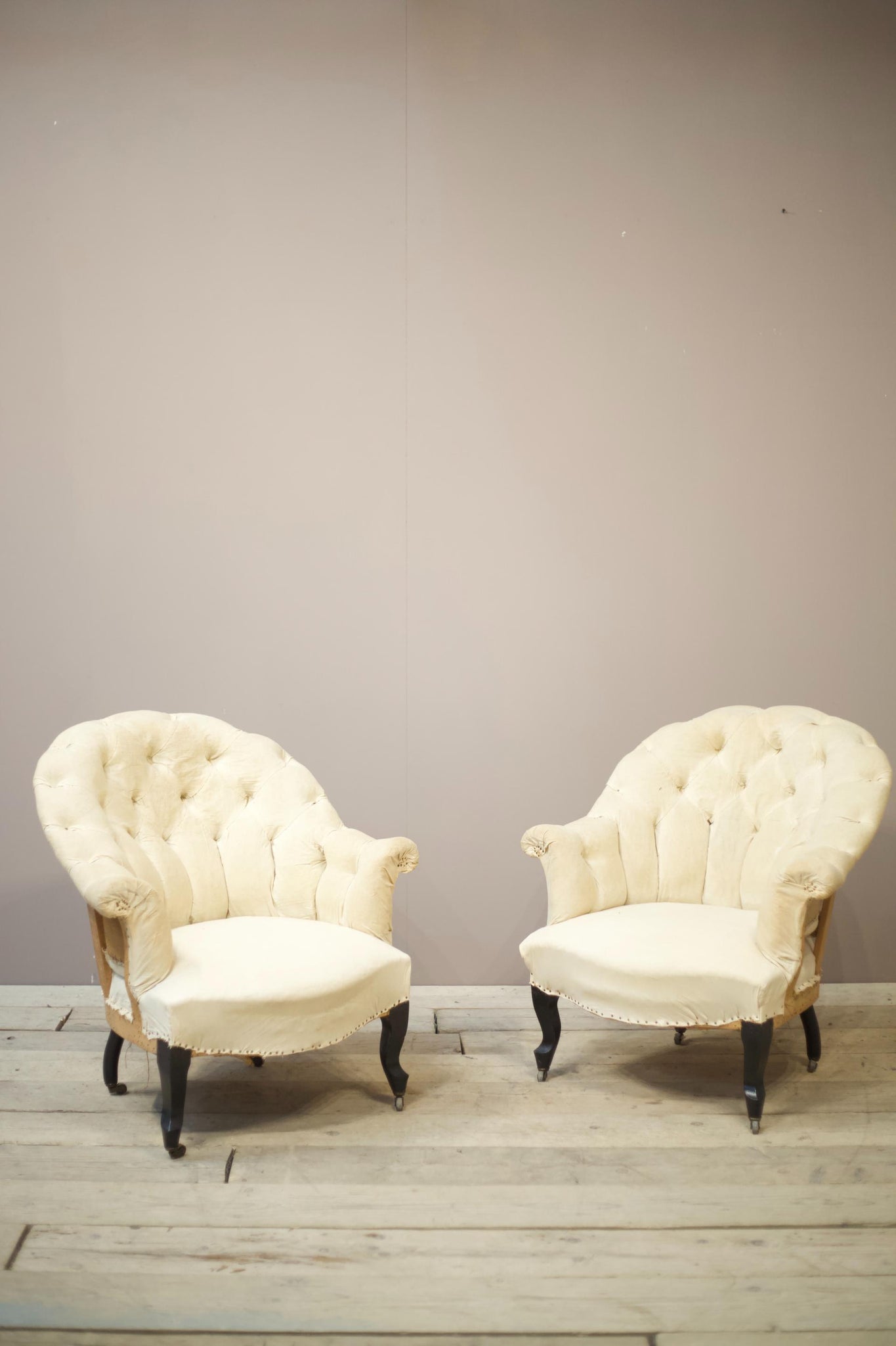 Pair of Napoleon III buttoned curve back armchairs
