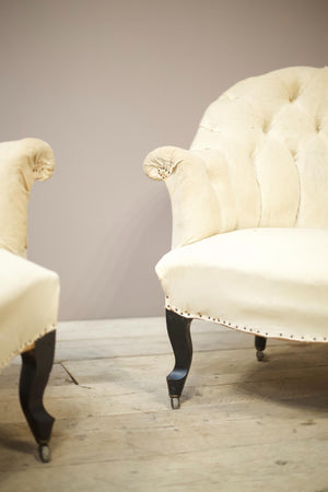 Pair of Napoleon III buttoned curve back armchairs