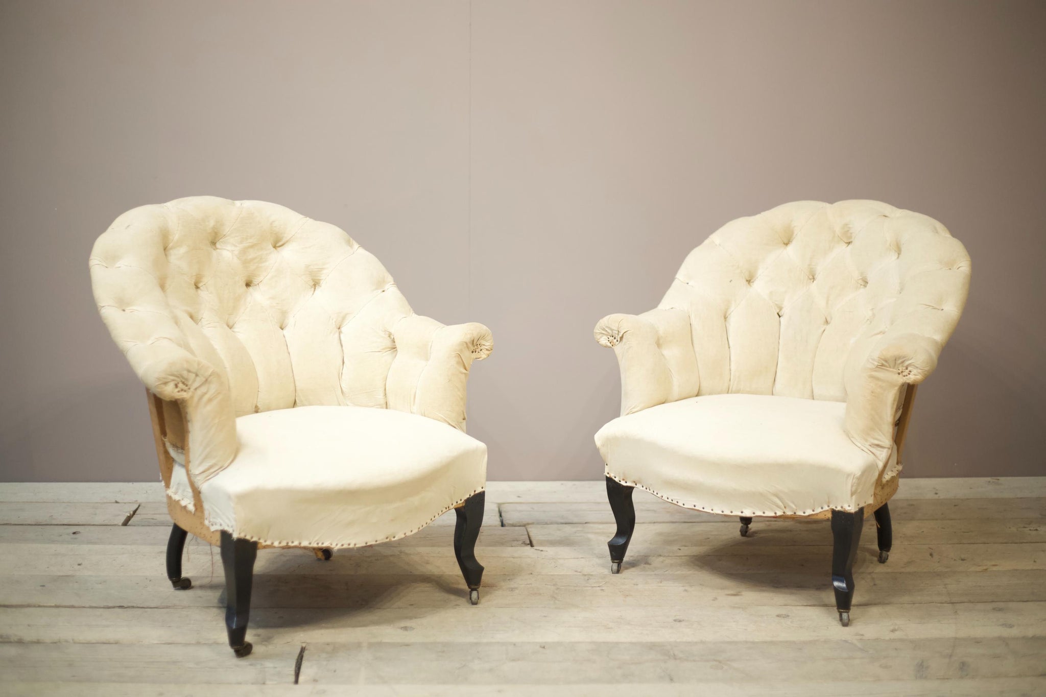 Pair of Napoleon III buttoned curve back armchairs