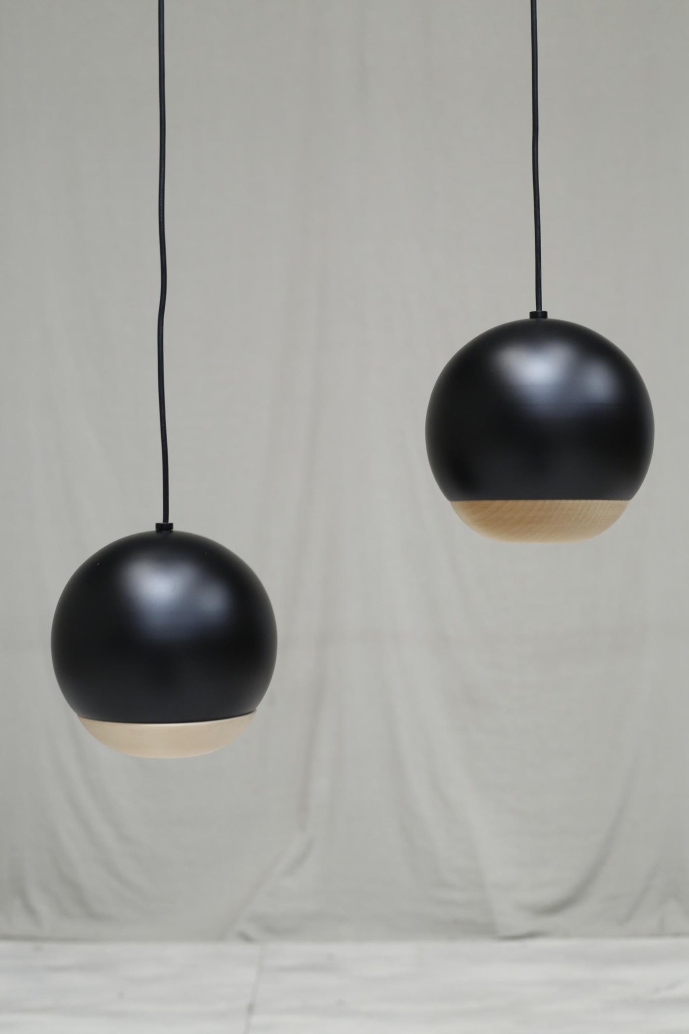 Italian black metal and beech Globe lights