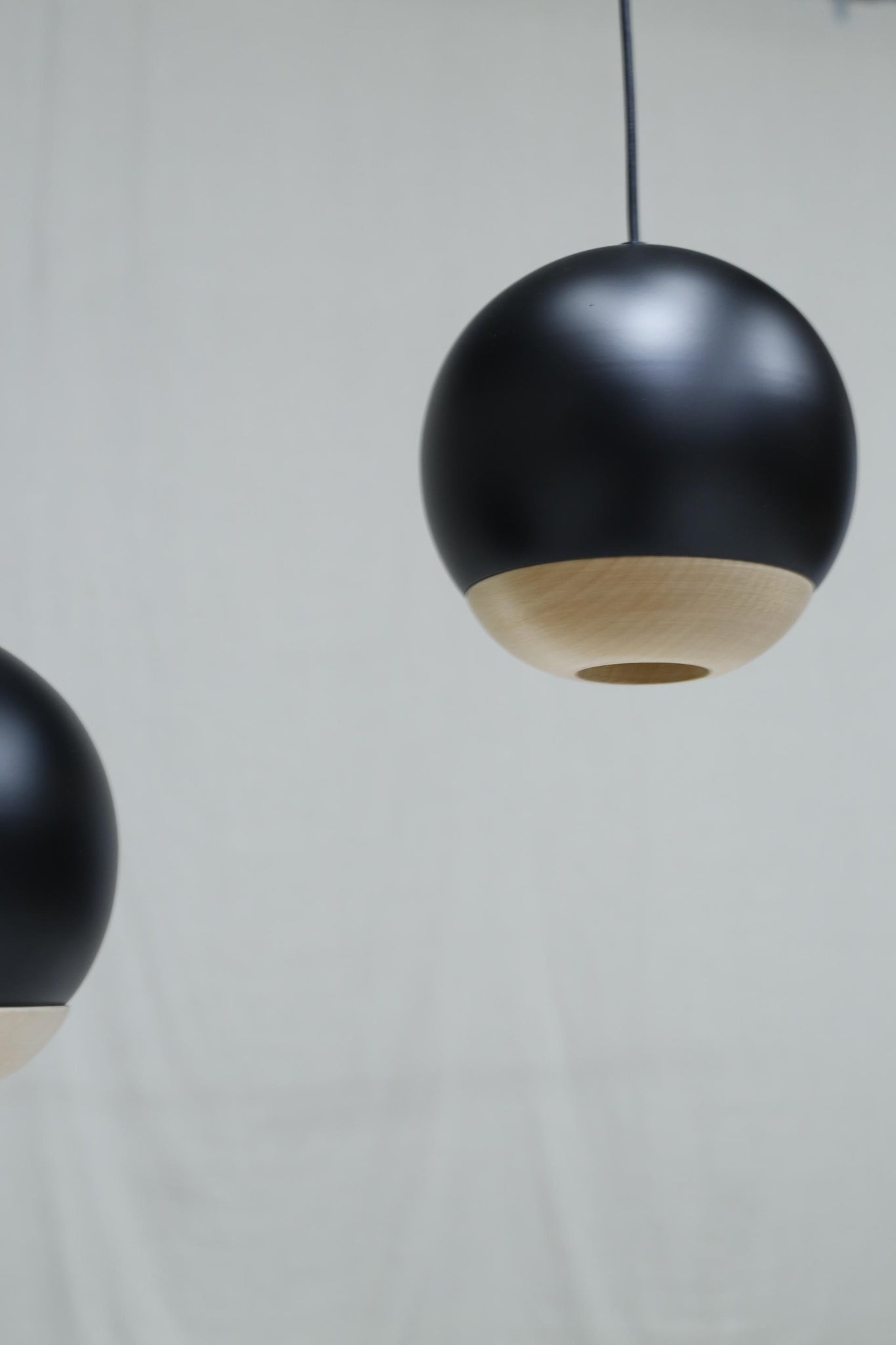 Italian black metal and beech Globe lights