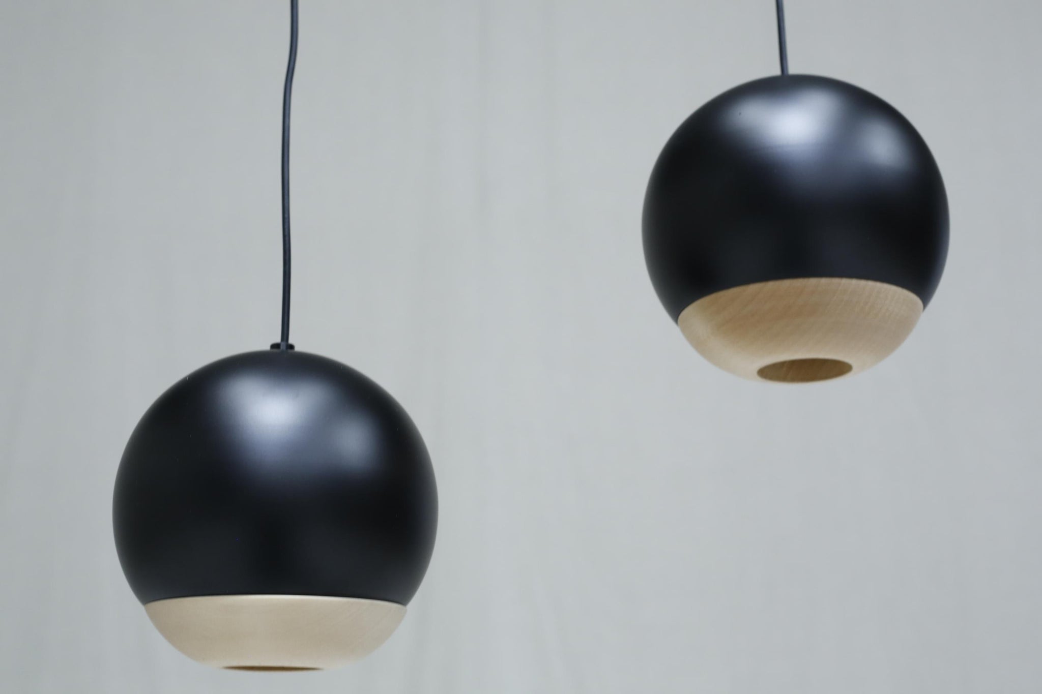 Italian black metal and beech Globe lights