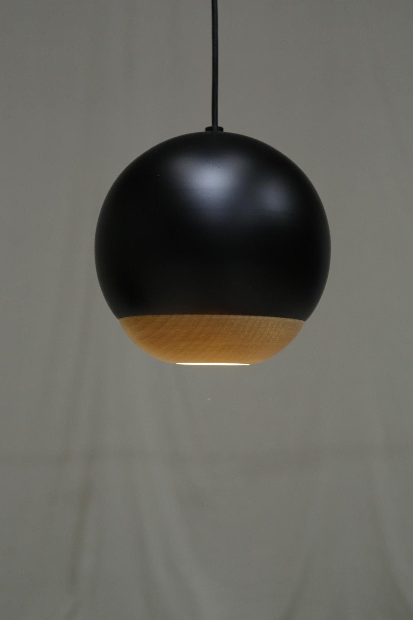 Italian black metal and beech Globe lights