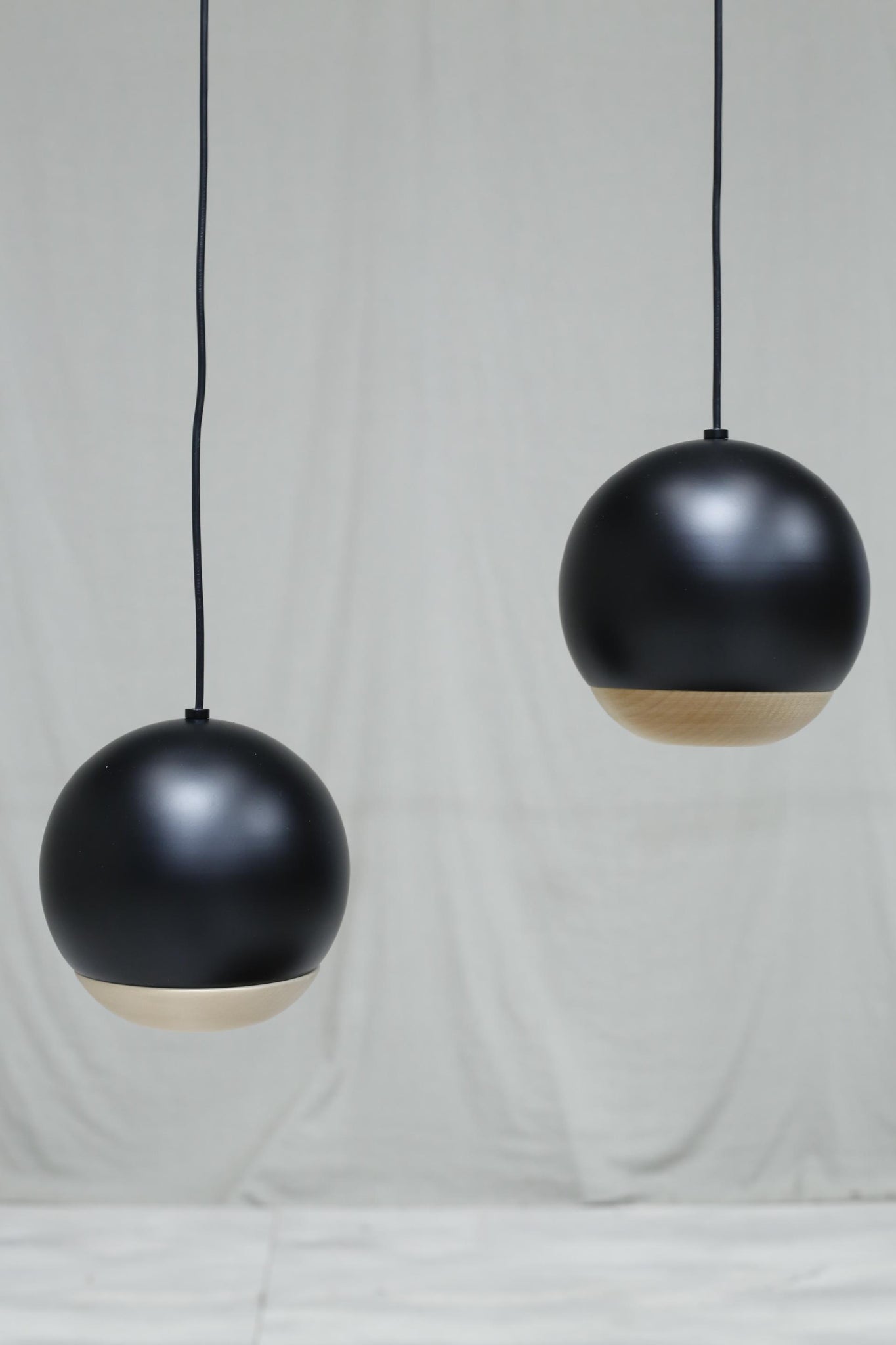 Italian black metal and beech Globe lights