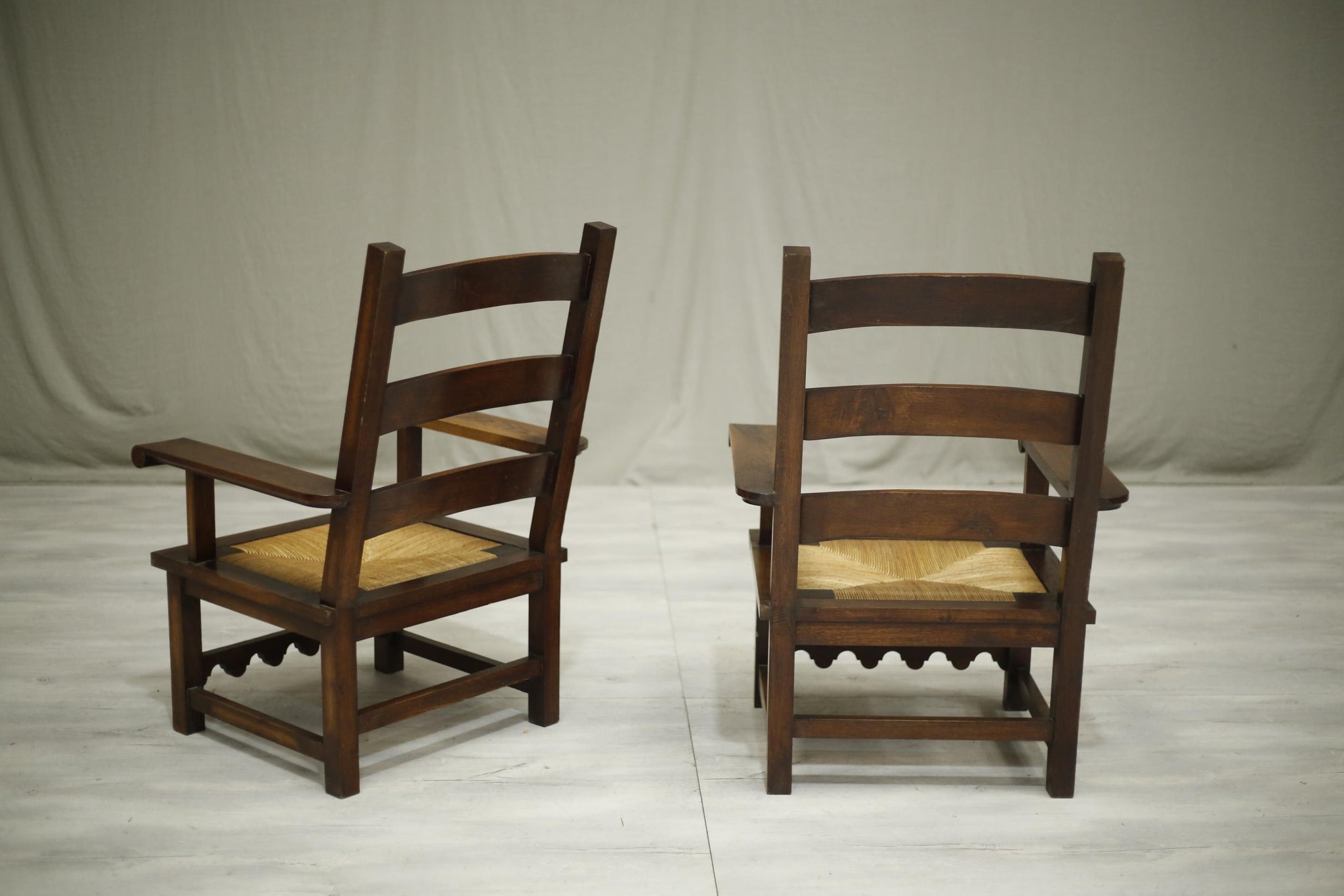 Pair of Mid century Japanese influence oak and rush seated armchairs