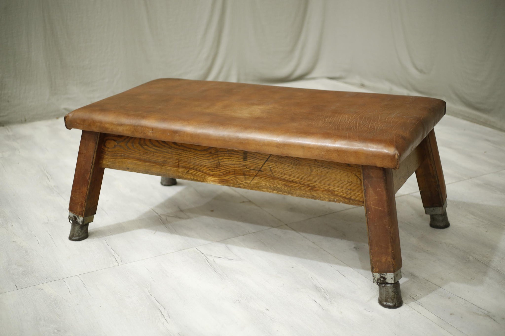 Vintage 20th century leather gym bench coffee table