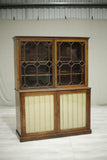 Antique Georgian mahogany glazed cabinet with material doors