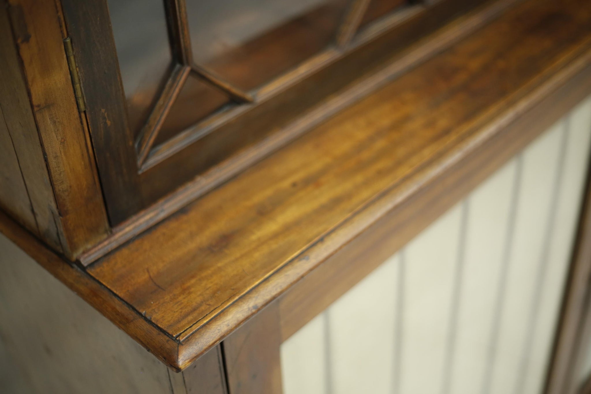 Antique Georgian mahogany glazed cabinet with material doors