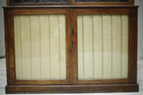 Antique Georgian mahogany glazed cabinet with material doors