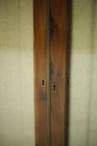 Antique Georgian mahogany glazed cabinet with material doors