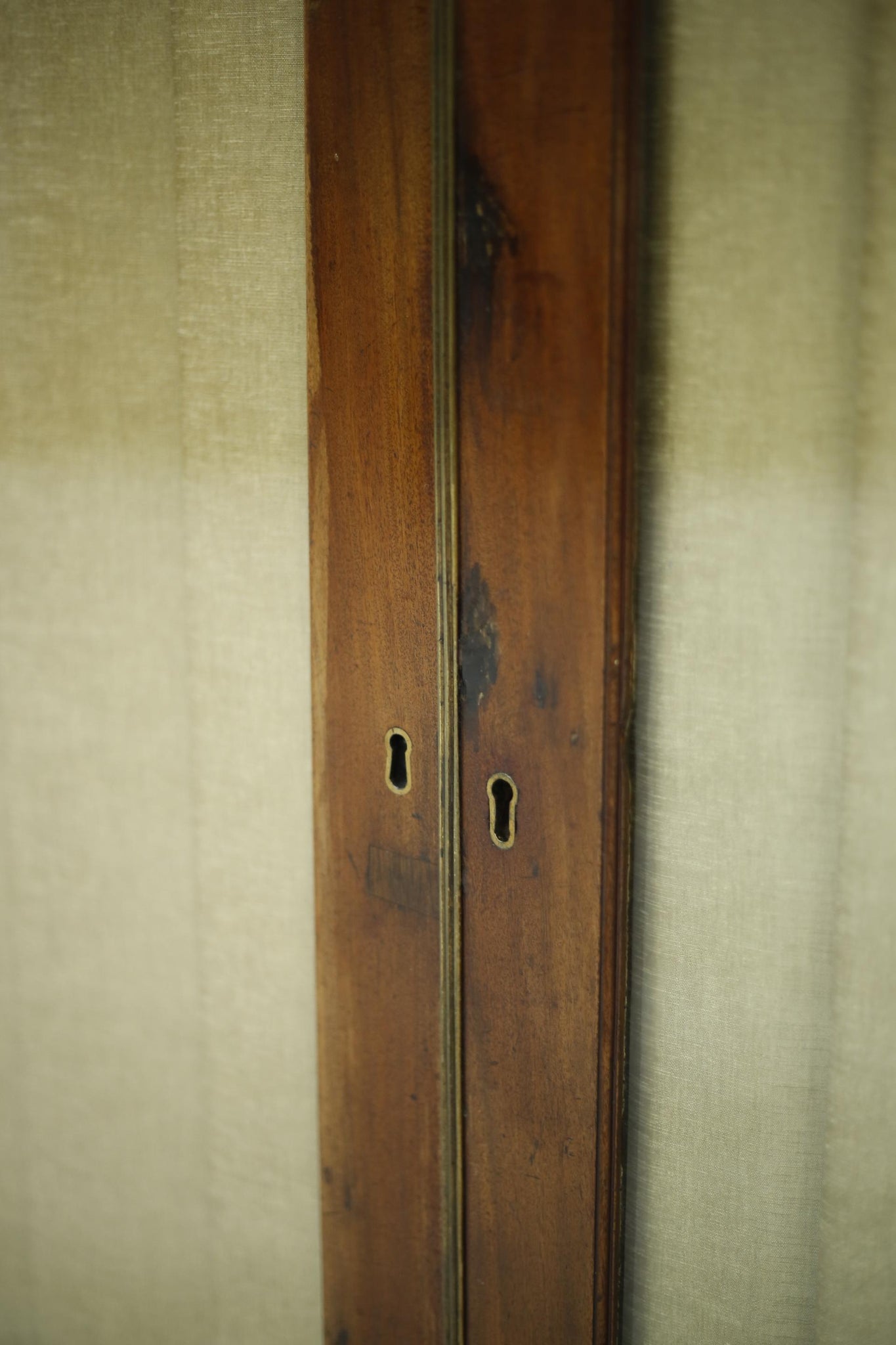 Antique Georgian mahogany glazed cabinet with material doors