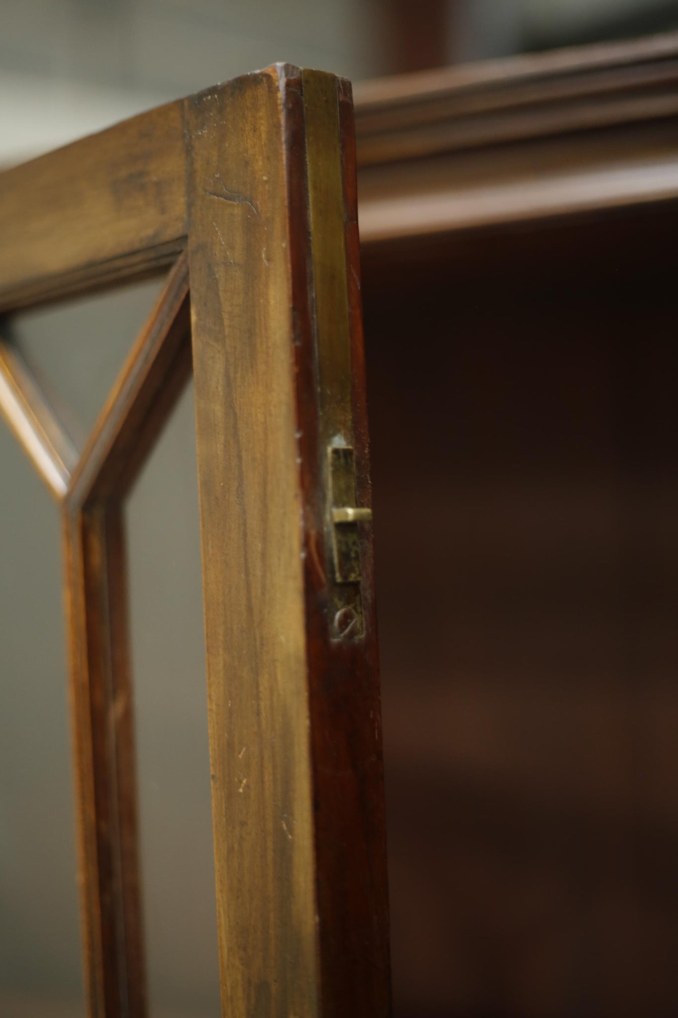 Antique Georgian mahogany glazed cabinet with material doors
