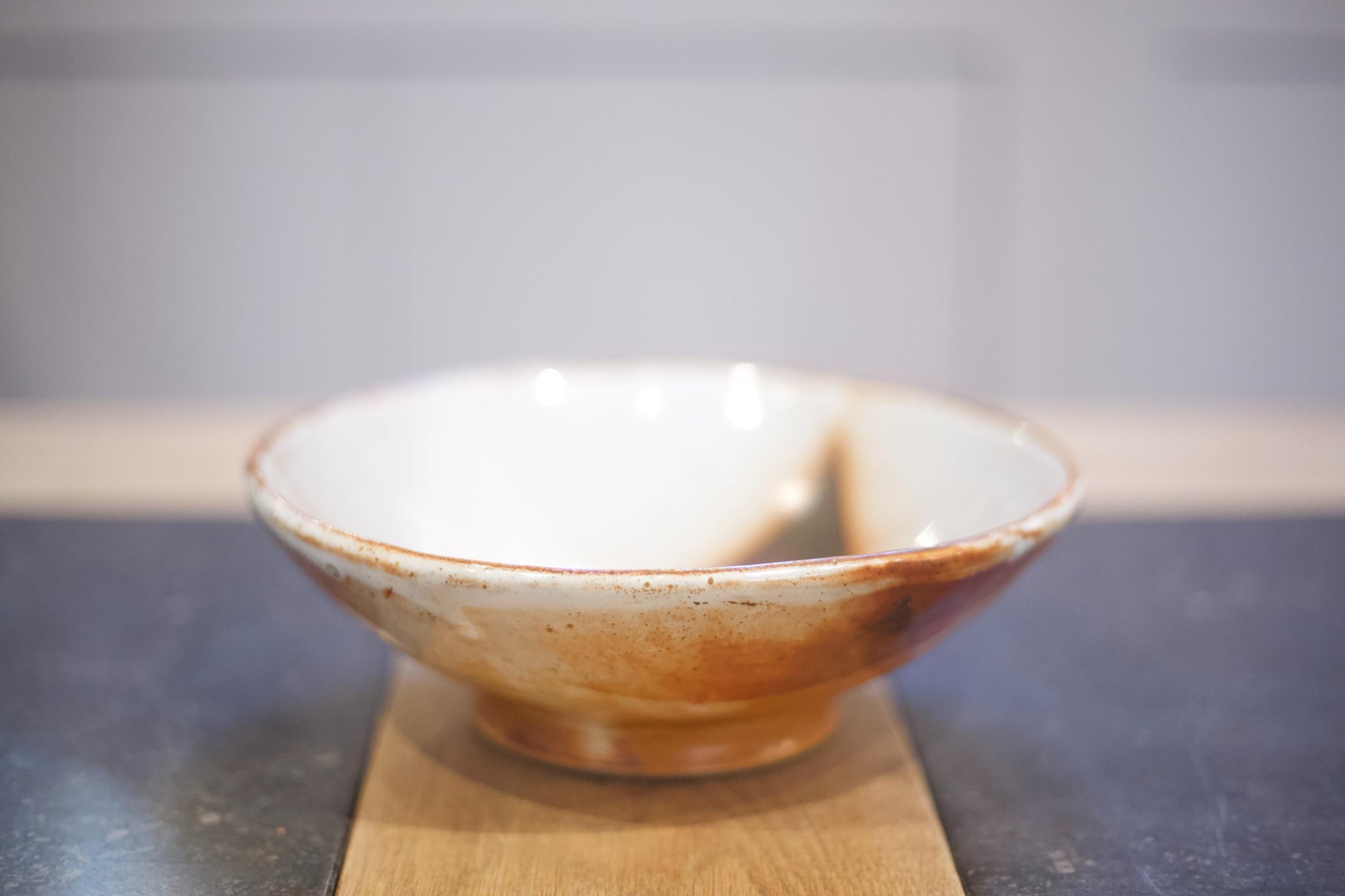 Vintage studio pottery bowl with brown decoration