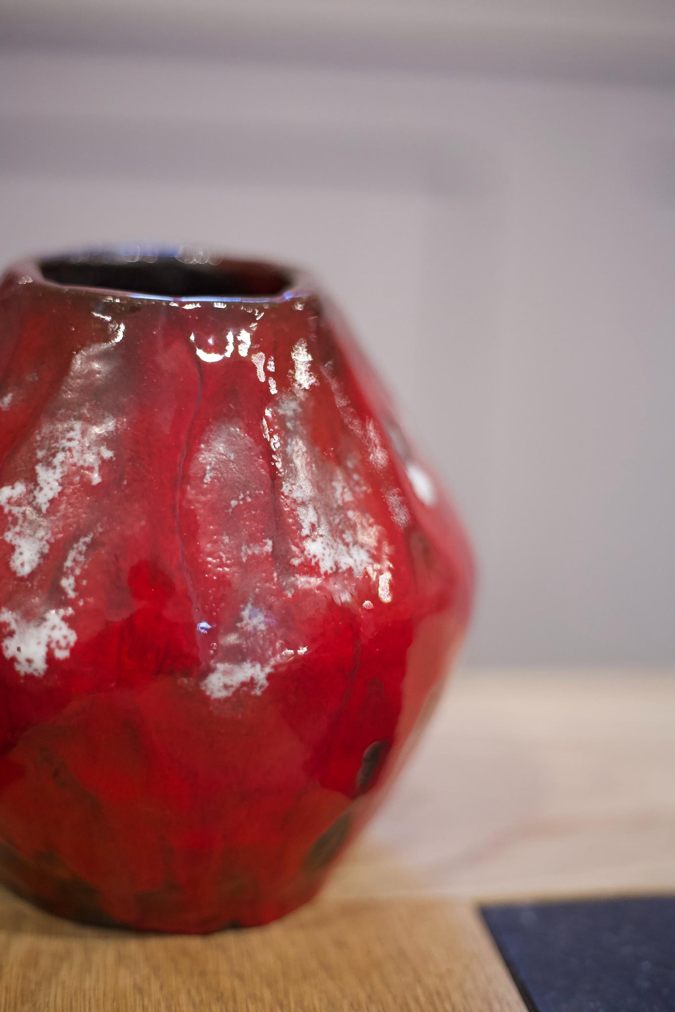Thick red glazed studio pottery vase