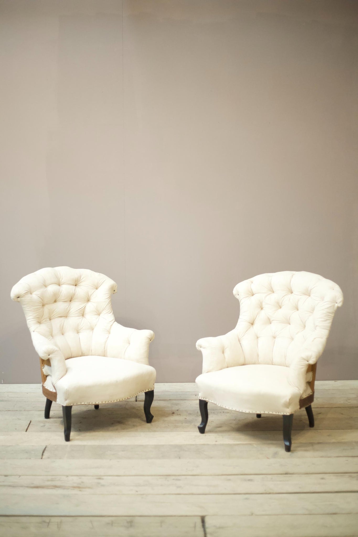 Pair of Napoleon III buttoned fishtail armchairs