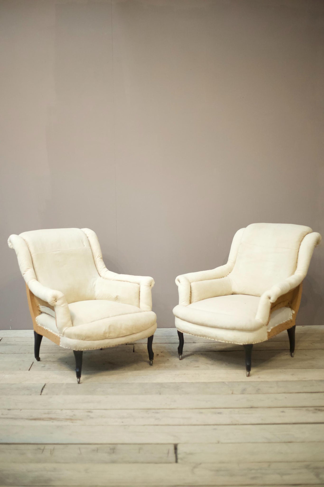 Pair of Napoleon III scroll back pie crust armchairs