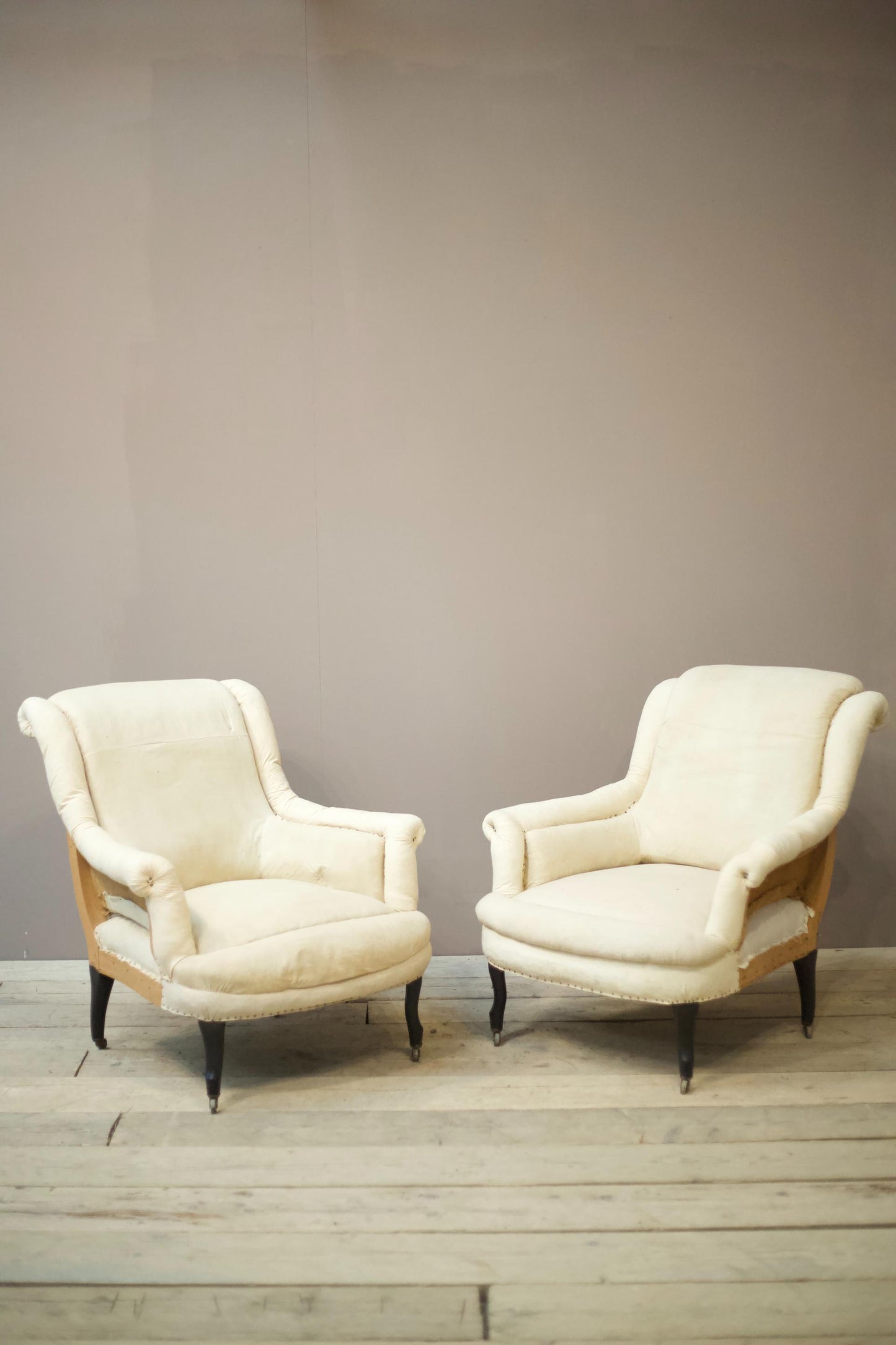 Pair of Napoleon III scroll back pie crust armchairs