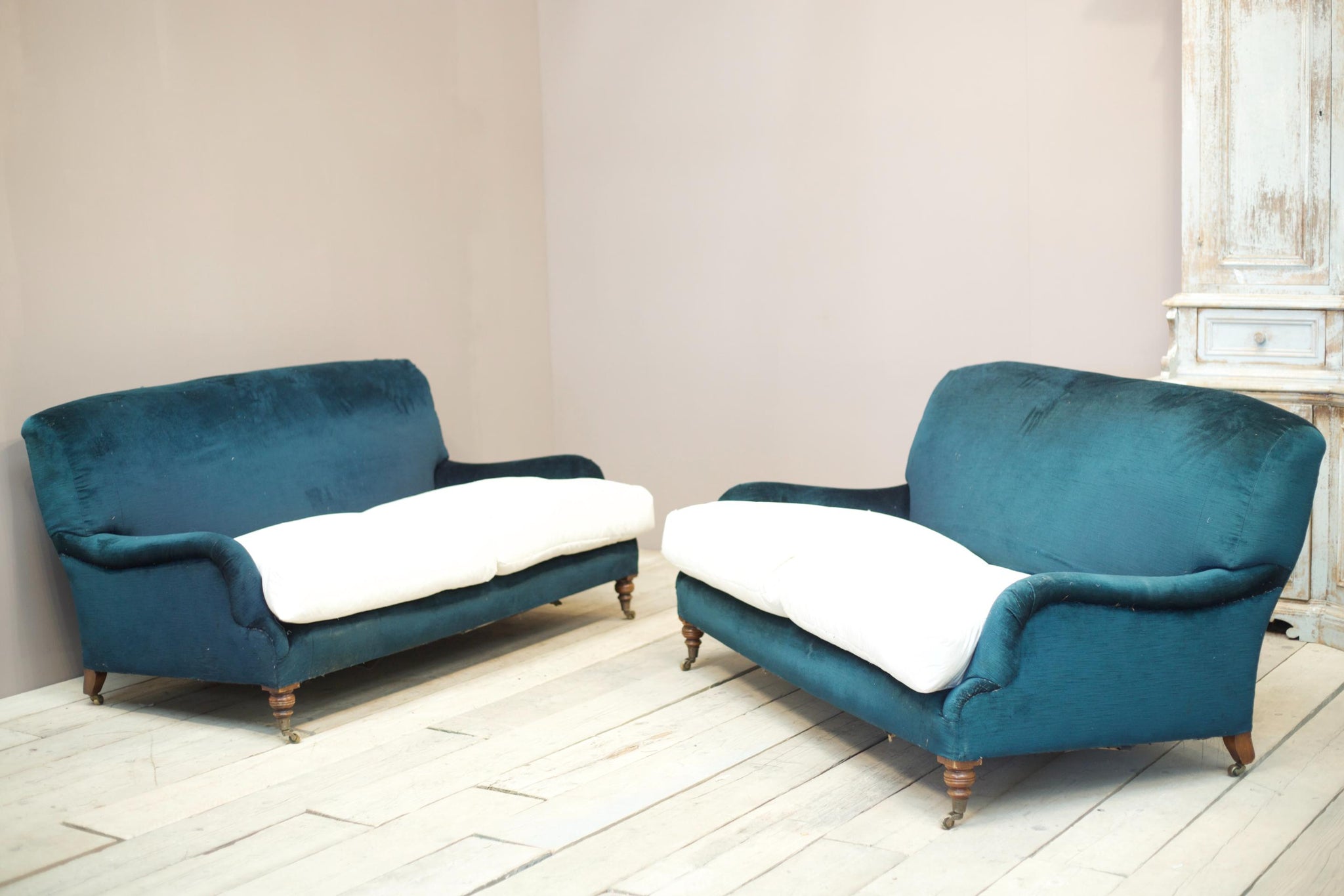 Pair of 20th century Howard and sons style sofas