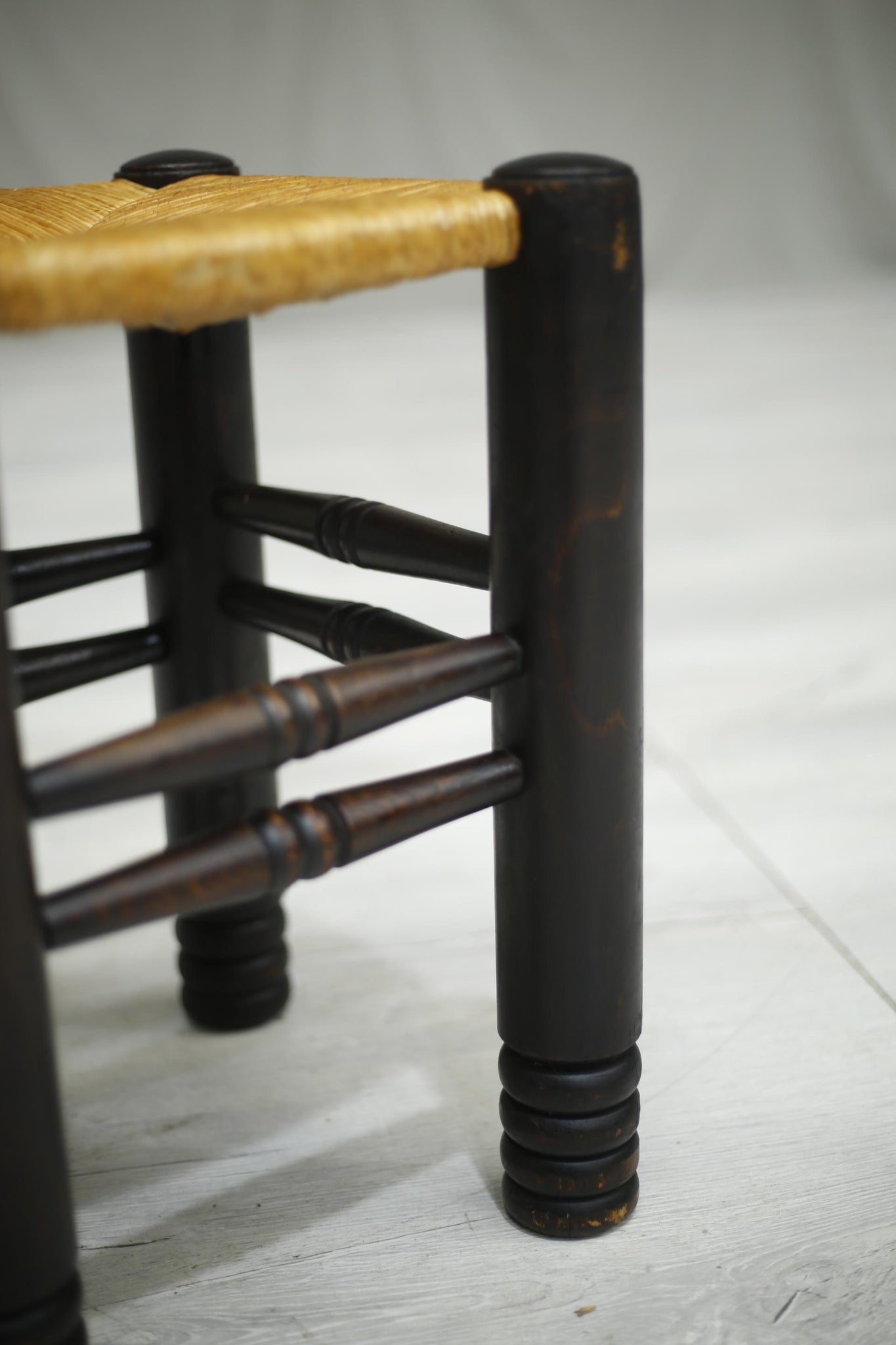 Mid century French ebonised and rush seated stool