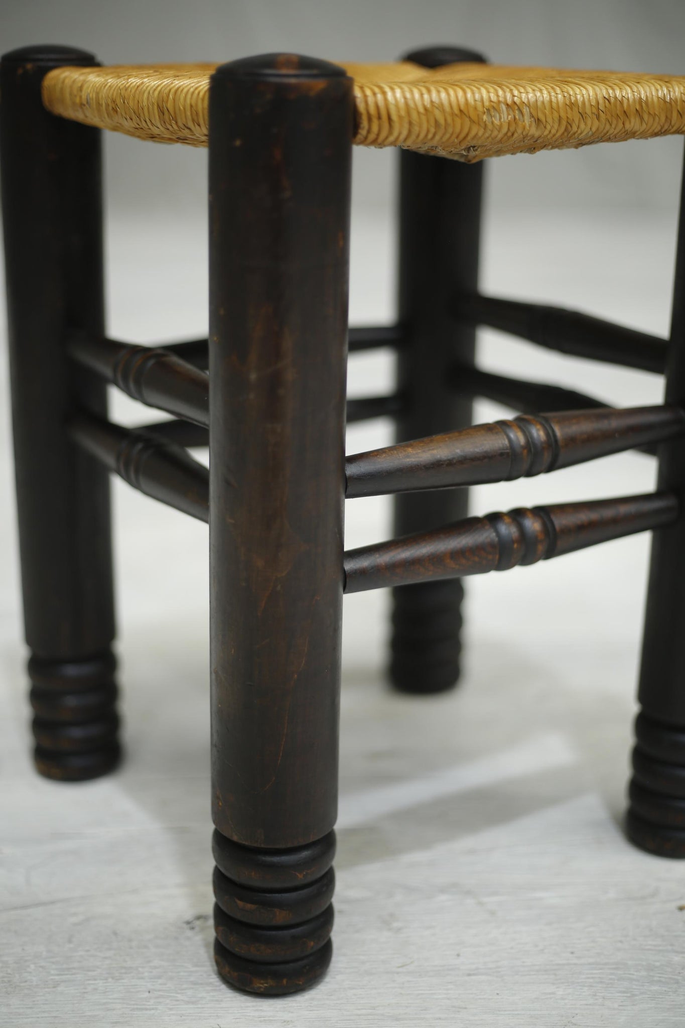 Mid century French ebonised and rush seated stool